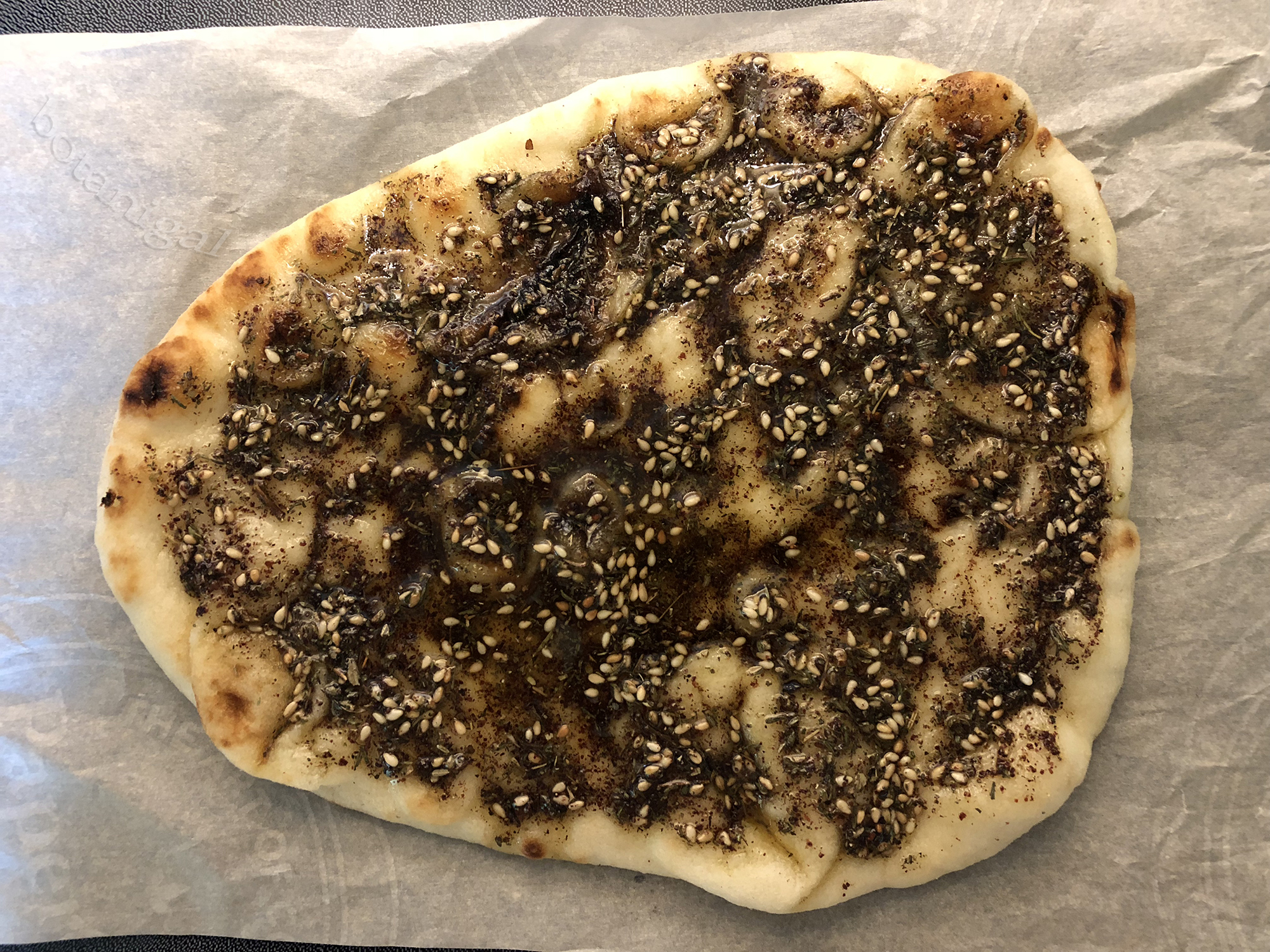 R.K. place coated naan on parchment 017 wtm.jpg