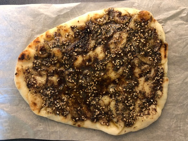 R.K. place coated naan on parchment 017 wtm.jpg